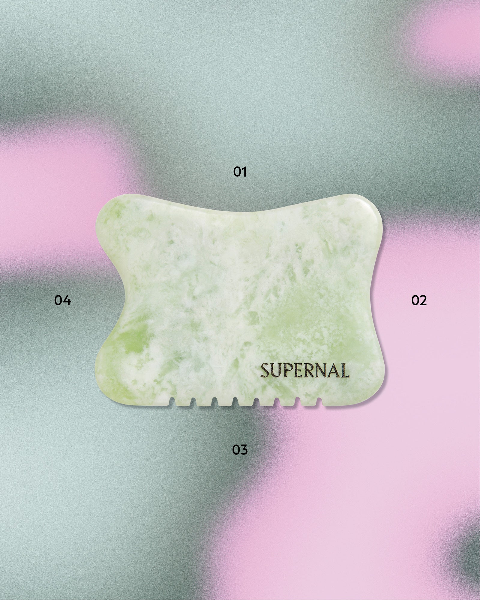 Xiuyan Jade Gua Sha stone on green and pink gradient background